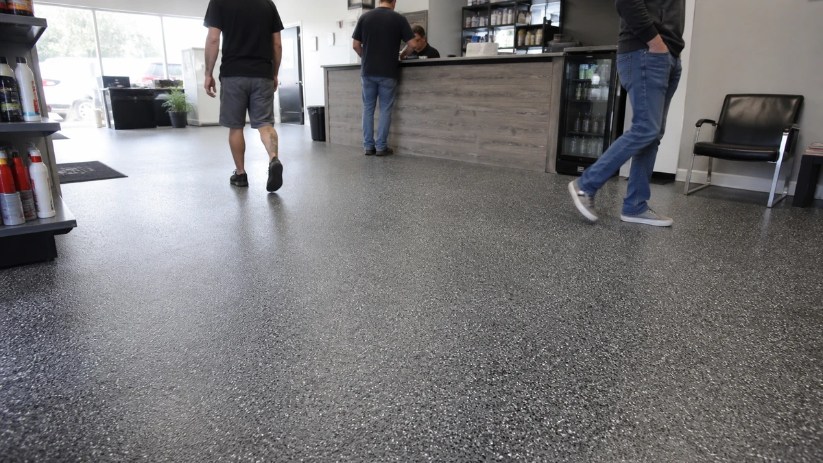 Staff walking through a clean commercial space with a coated floor